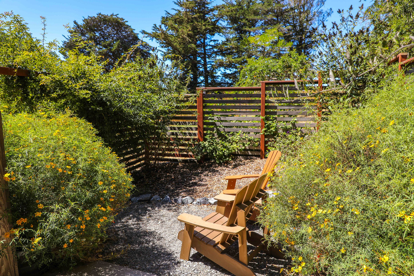 The privacy fence around the backyard of the Writer's Cottage.
