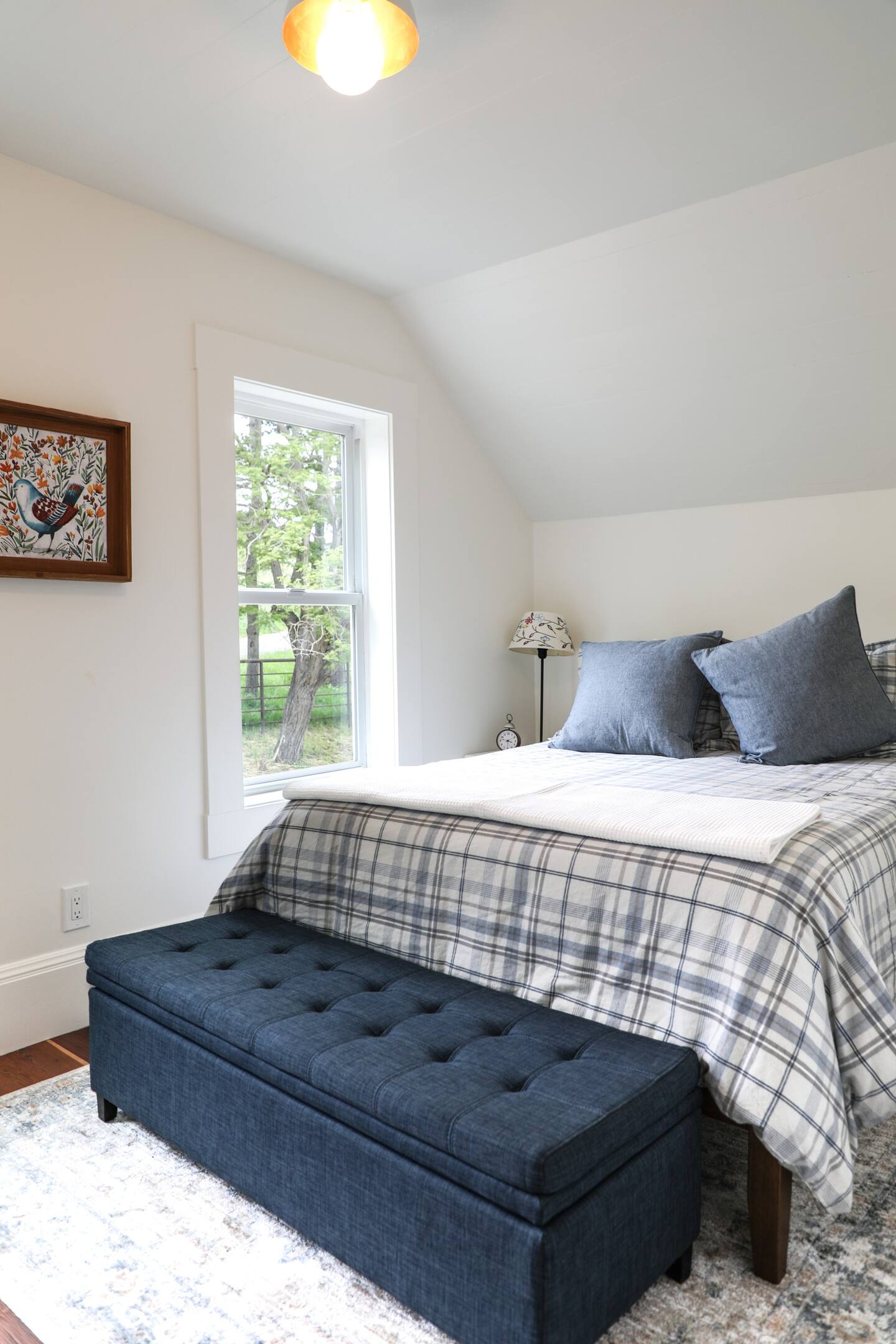 This full-sized bedroom is upstairs.