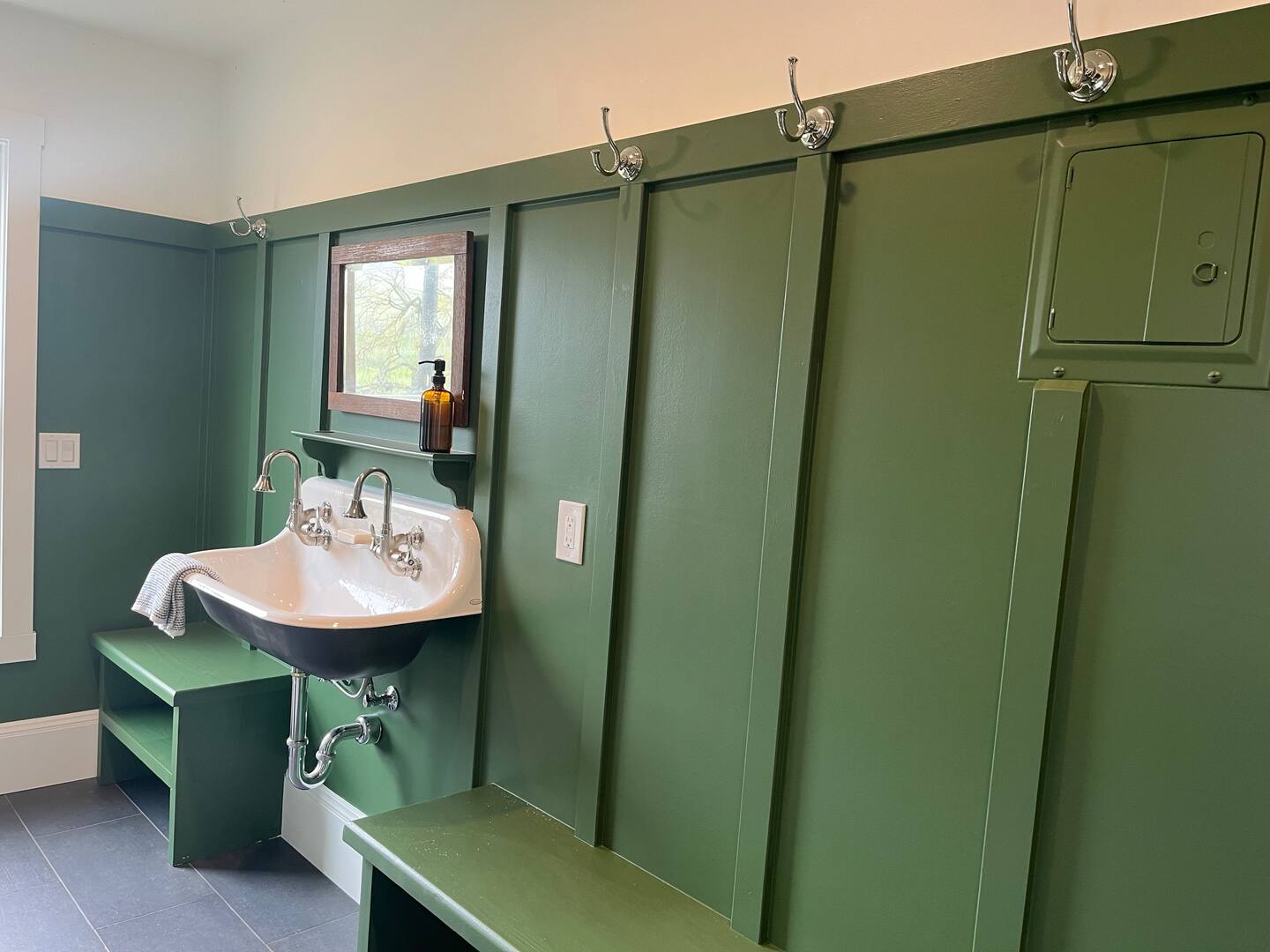 The mudroom has a full bathroom, laundrey room, and walk-in pantry just off the kitchen.