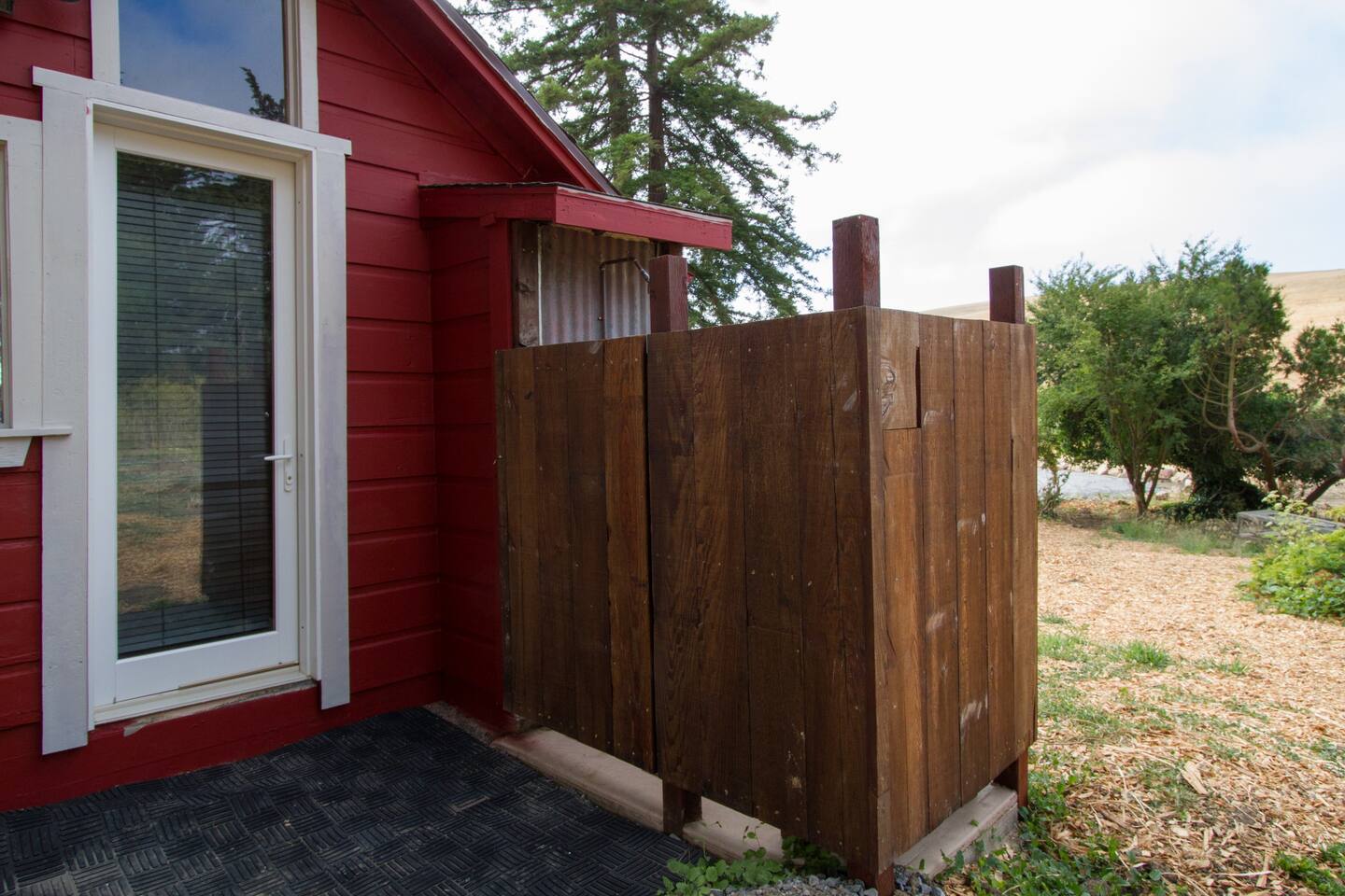 The outdoor shower. (There is now a privacy fence and bushes all around this area.)