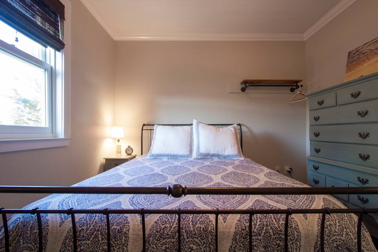 The first bedroom has a queen-sized bed.