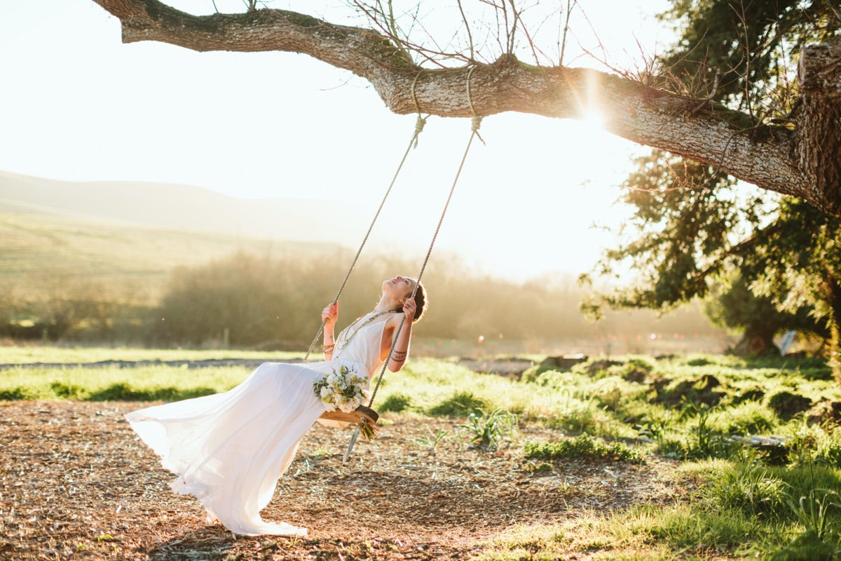 Elegant bridal portrait on ranch swing