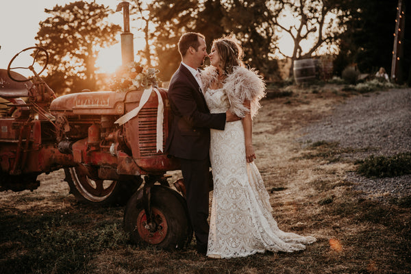 Romantic couple photo with vintage farm tractor