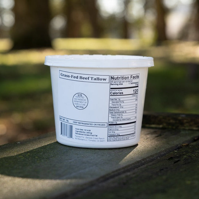 Small container with a label on a wooden surface outdoors