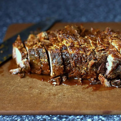 Sliced beef brisket on a wooden cutting board